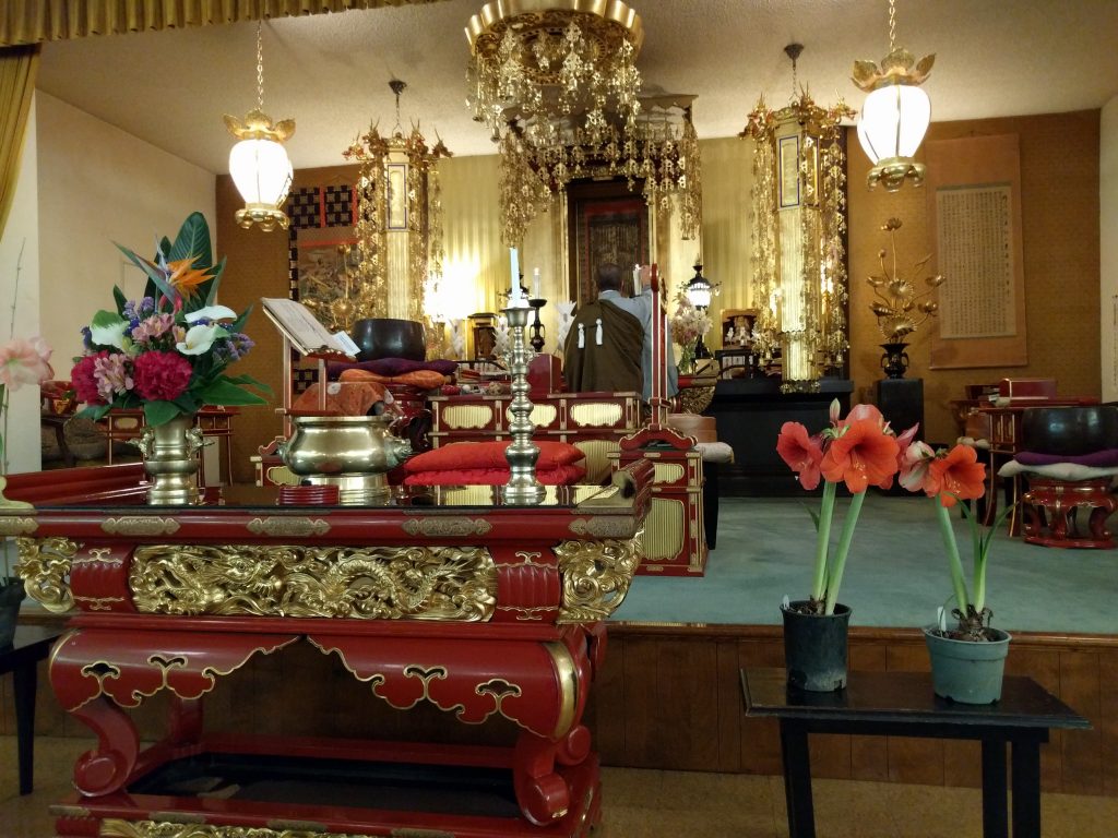 Ven. Kenjo Igarashi prepares altar before the Kaishu-e service honoring the founding of the Nichiren Shu lineage.